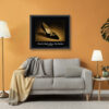 Framed Beltrami shoe print from the Imelda Marcos Shoe Collection displayed as museum-quality wall art above a sofa in a contemporary living room.