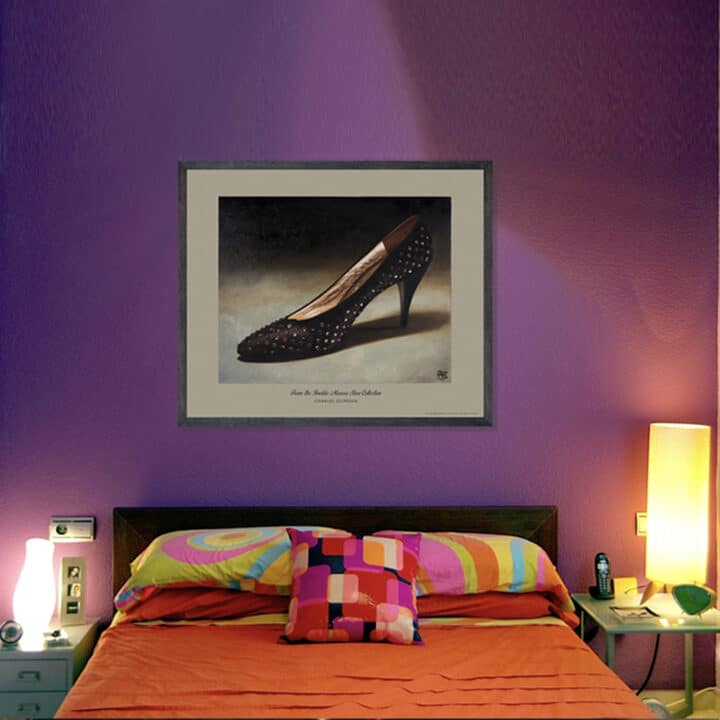 Framed Charles Jourdan Serenade Pump art print from the Imelda Marcos Shoe Collection displayed in a colourful bedroom.