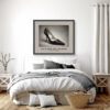 Framed Dolce & Gabbana Eel Skin Pump art print from the Imelda Marcos Shoe Collection displayed above a bed in a contemporary bedroom.