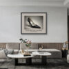 Framed Dolce & Gabbana Eel Skin Pump art print from the Imelda Marcos Shoe Collection displayed in a contemporary living room.