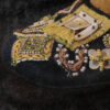 Close-up of Fendi Imelda Marcos shoe print showing beaded floral and pearl embroidery on the black mule toe