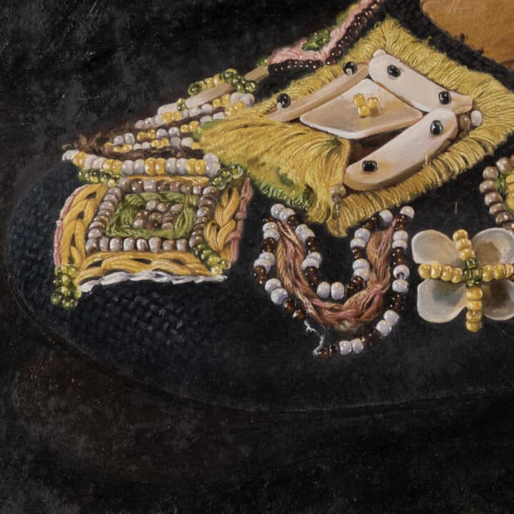 Close-up of Fendi Imelda Marcos shoe print showing beaded floral and pearl embroidery on the black mule toe