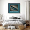 Framed Givenchy Paris Kitten Heel art print in textured turquoise leather with teal and gold bow, displayed above a bed.