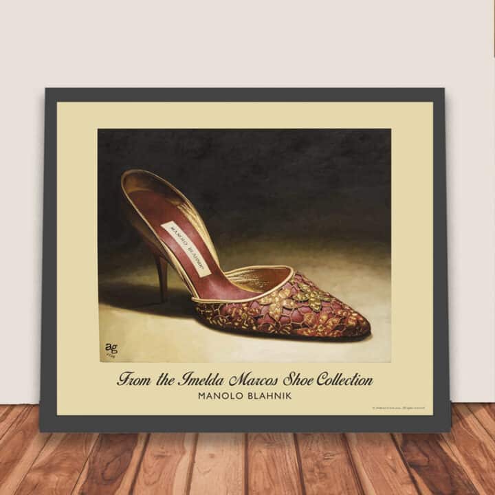 Framed Manolo Blahnik shoe print of red satin tapestry embroidered heels with gold floral piping, shown ready for wall hanging.