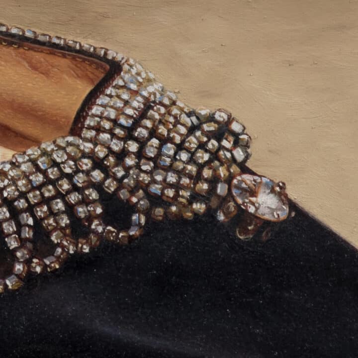 Close-up of Manolo Blahnik Rhinestone Heels showing crystal embellishment and scalloped detailing on black silk
