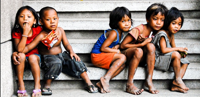 Group of children in Manila, Philippines, representing the vulnerable boys and girls supported through the Sole Support humanitarian project.