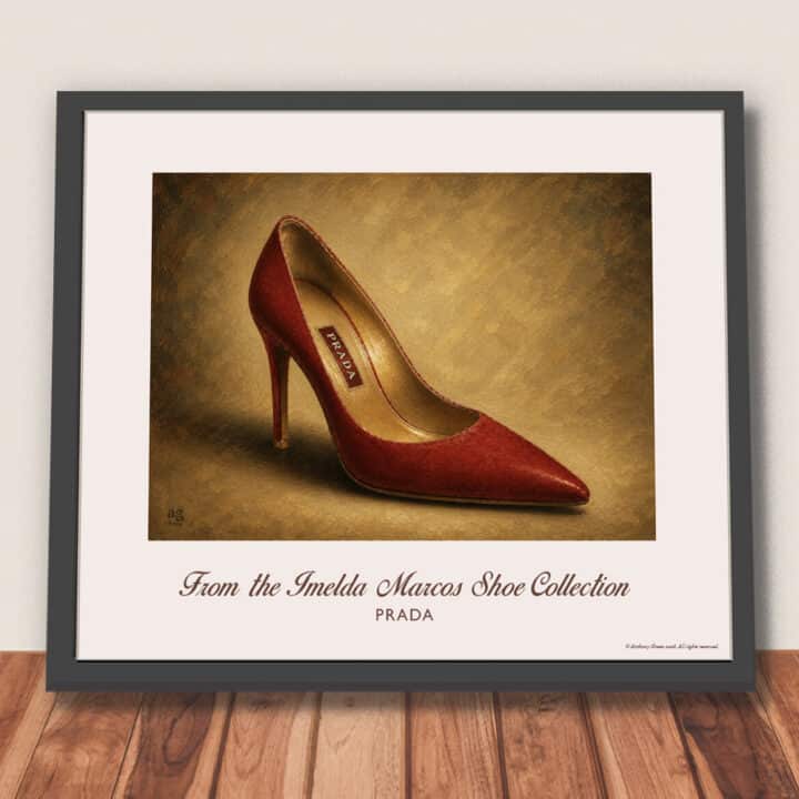 Framed Prada Red Velvet Pumps art print featuring gold metallic lining and high stiletto heel, shown against a wall ready for hanging