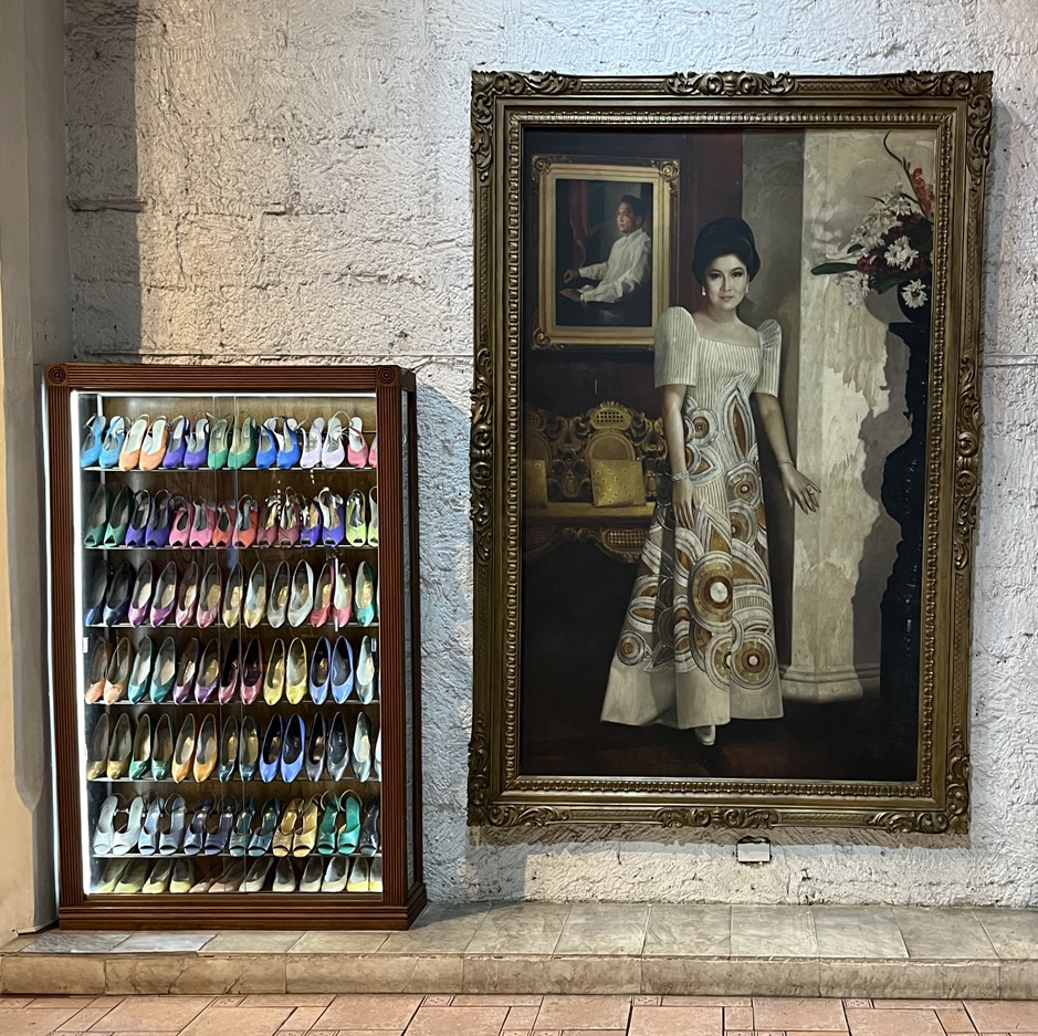 Imelda Marcos shoes displayed beside a full-length portrait of the former First Lady at the Marikina Shoe Museum in 2026.